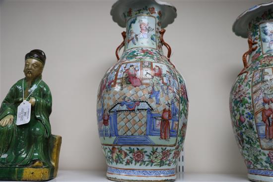 A pair of Chinese famille rose vases, 19th century, H. 45cm, one with section of rim lacking